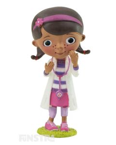 In costume, wearing her doctor's coat and stethoscope straight out of the toy hospital, Dottie McStuffins, is ready to fix your toys, dolls and stuffed animals for some fun imaginative play or makes a cute cake topper for your Doc McStuffins party.