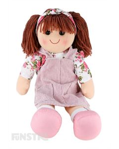 Alice is a gorgeous doll with a soft cloth body and reddish-brown hair tied back in pigtails with a headband and wears a corduroy pink pinafore dress over a floral white and pink blouse.