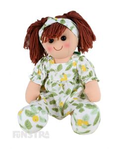 Lucy is an sweet doll with a soft cloth body and brown hair tied back in pigtails and wears a lemon print patterned dress and a matching headband.