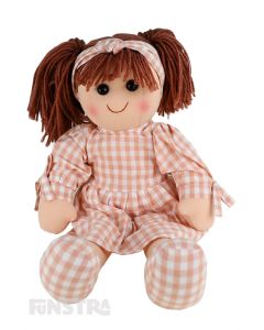 Sadie is an down to earth doll with a soft cloth body and brown hair tied back in pigtails and wears a peach printed dress featuring a gingham pattern and a matching headband.