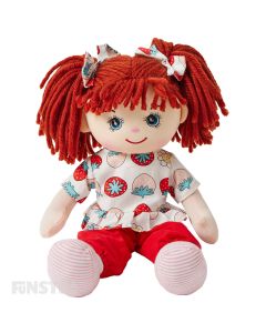 Dottie is a sweet rag doll with a soft cloth body and red hair tied in pigtails and wears a berry sweet top featuring a strawberry print on it with red pants and loves baking and running in the park.