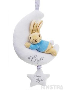 Peter Rabbit cuddles a moon. Pull down on the star to hear lullaby music.