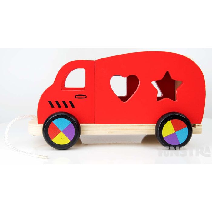 Children can learn shape as they place them through the openings on the wooden vehicle.