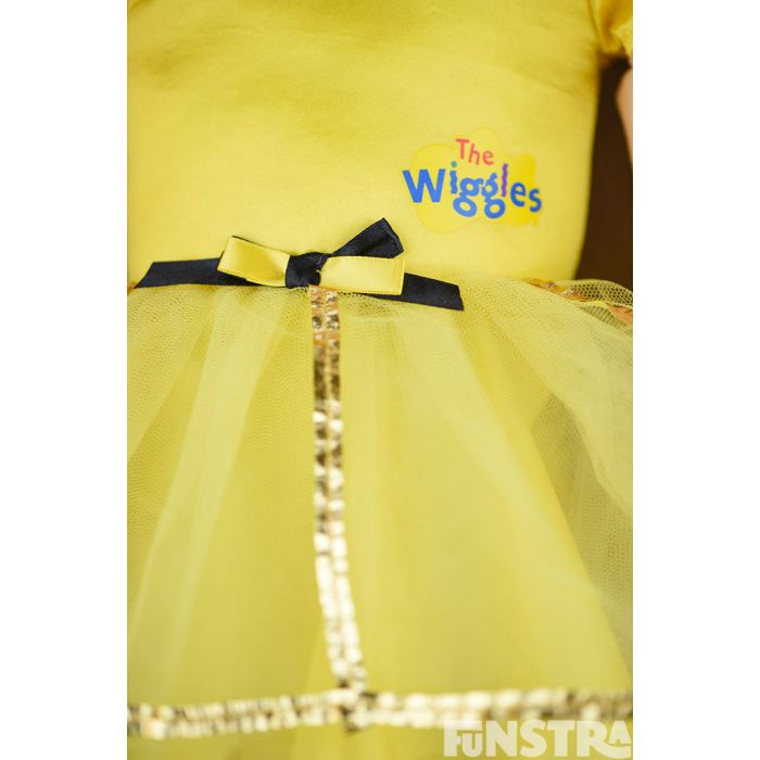 The dance with me doll wears a bowtiful ballerina costume, with a yellow tutu and yellow skivvy.