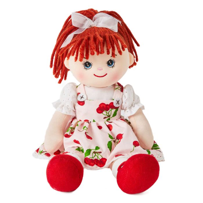Avery is a super sweet rag doll with a soft cloth body and bright red hair tied in a ponytail and wears a beautiful cherry print dress and loves to do puzzles and climb trees.