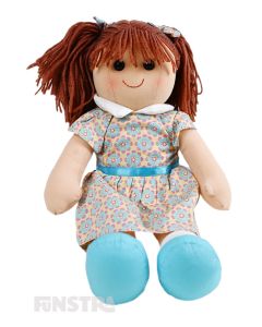 Evie is an delightful doll with a soft cloth body with auburn hair tied in pigtails with bows and wears a vintage geometric floral print dress.