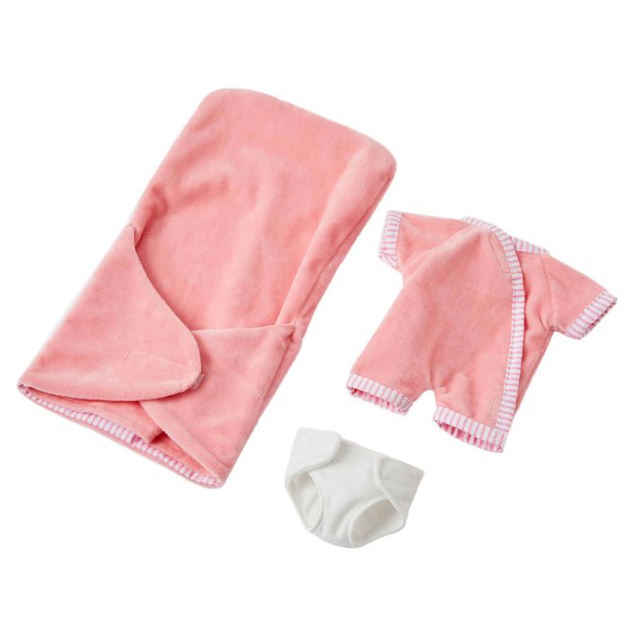 Baby doll Molly comes with nappy, jumpsuit and sleeping bag.