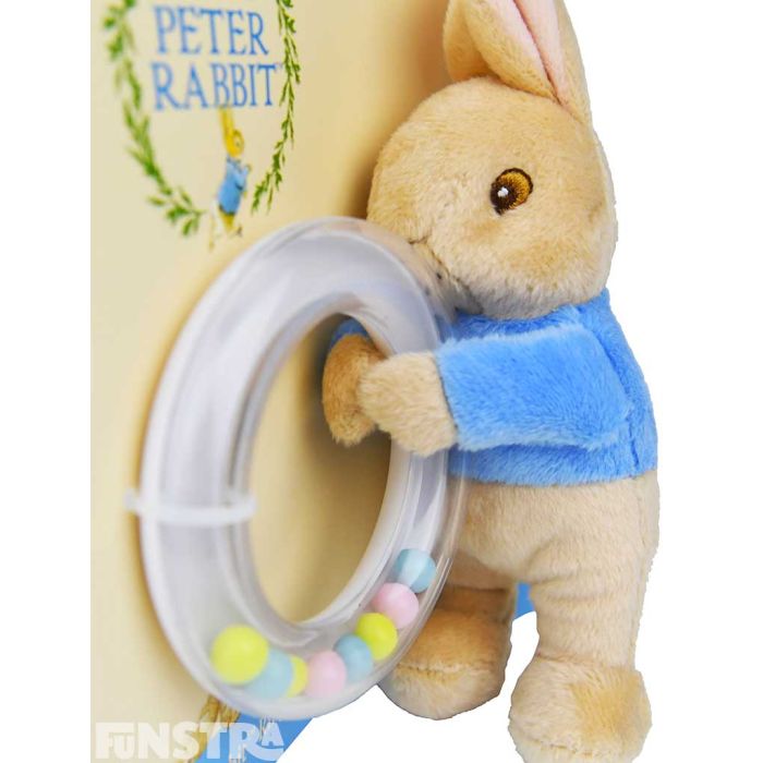 The mischievous Peter holds a ring rattle that will entertain little bunnies!